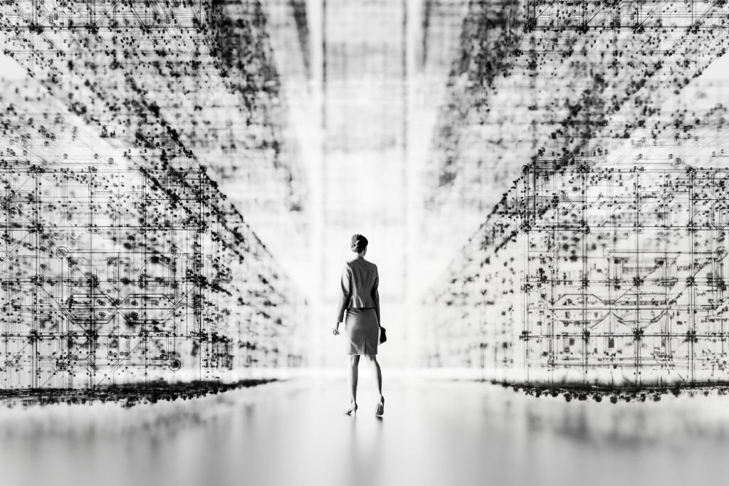 Silhouette walking through a data corridor